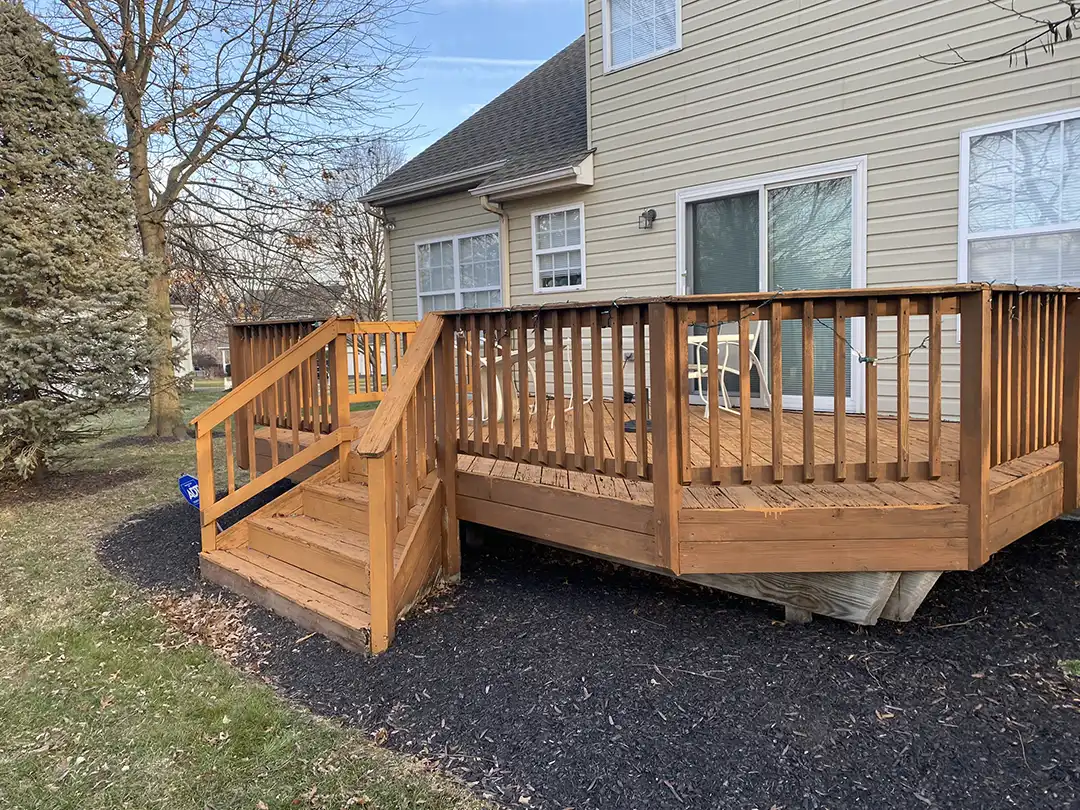 Photo of a wooden deck before a deck remodeling project