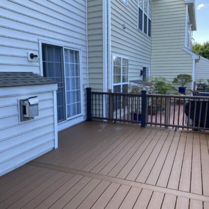 Photo of a composite deck with black railing and gate