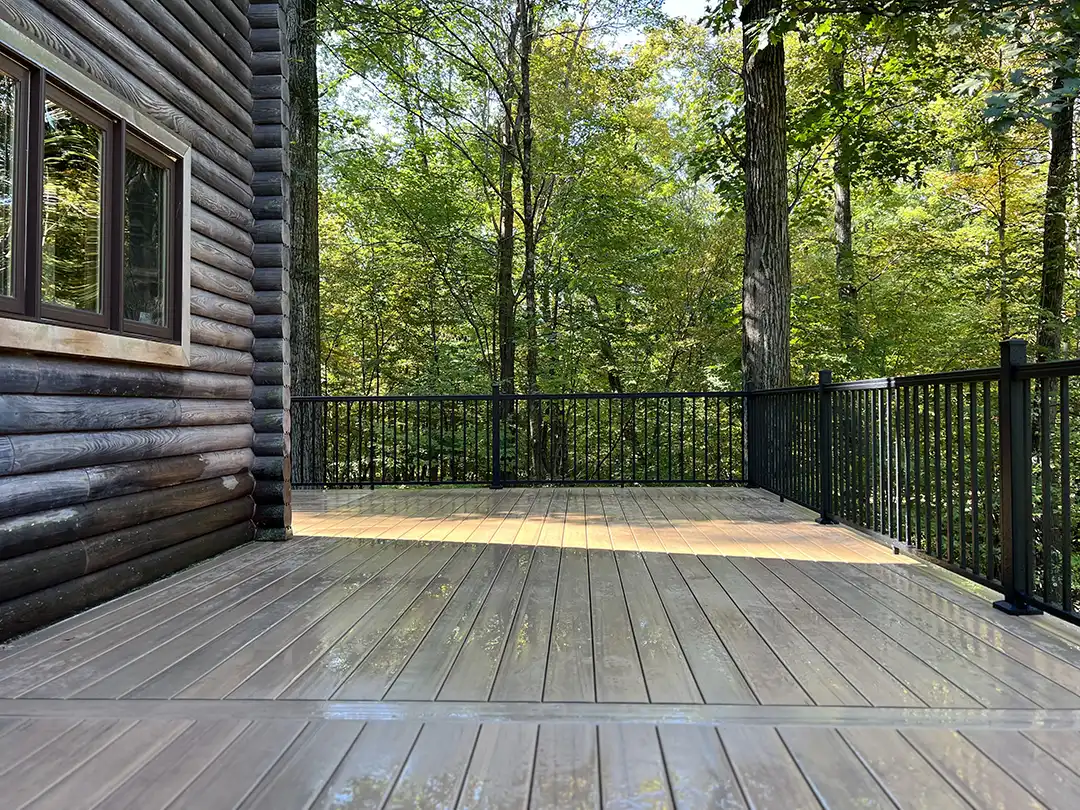 Photo of a wrap-around deck with black deck railing - Custom Deck Builders in New Hope PA