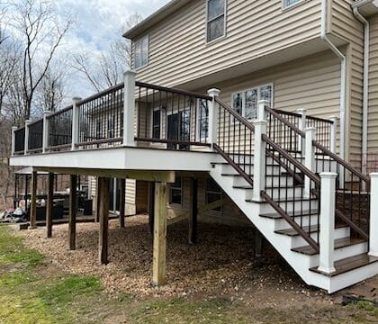 Photo of elevated deck with railing and steps