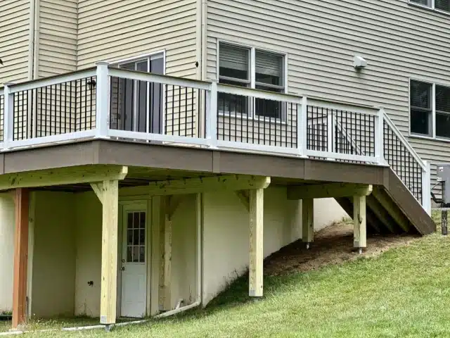 Elevated Composite Deck with Black railings and stairs - Deck contractors near me in Maple Glen PA