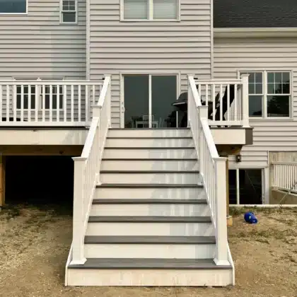 Elevated Composite Decking Project with timbertech stairs and white vinyl railings - Deck building Company in Pipersville PA