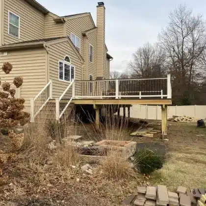 Elevated TimberTech Compsite deck with black railings and lights - Deck company in Pipersville PA