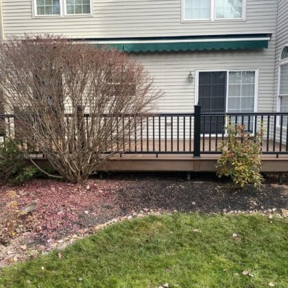 Wide view composite deck with center inlay and deck railing