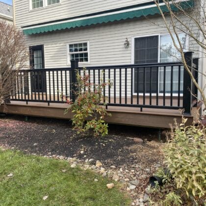 Photo of composite deck with center inlay and deck railing