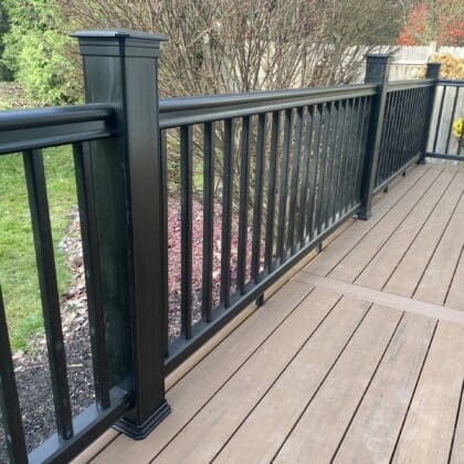 Photo of composite deck with center inlay and black deck railing