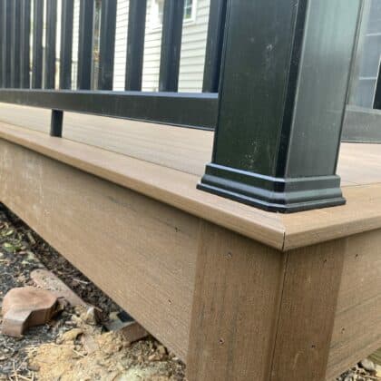 Photo of corner of deck with fascia and trim