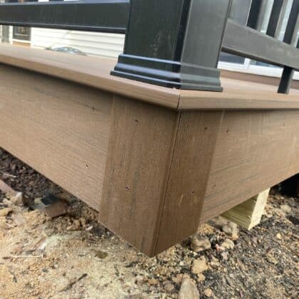 Photo of corner of deck with fascia and trim