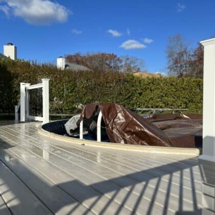 Photo of curved deck that touches pool side