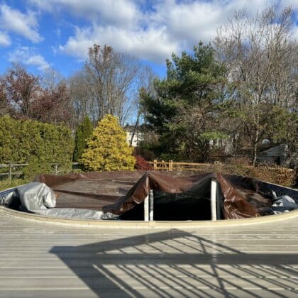 Photo of curved deck that touches pool side