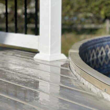 Close up of curved deck that touches pool side