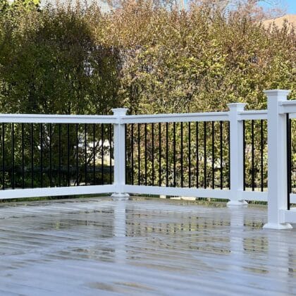 Photo of deck corner with railing and balusters