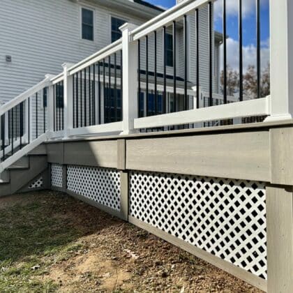 Photo of white deck railing and deck steps