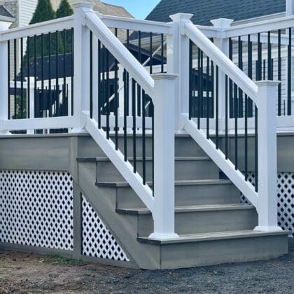 Photo of white deck railing and deck steps