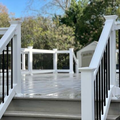 Photo of white deck railing and deck steps