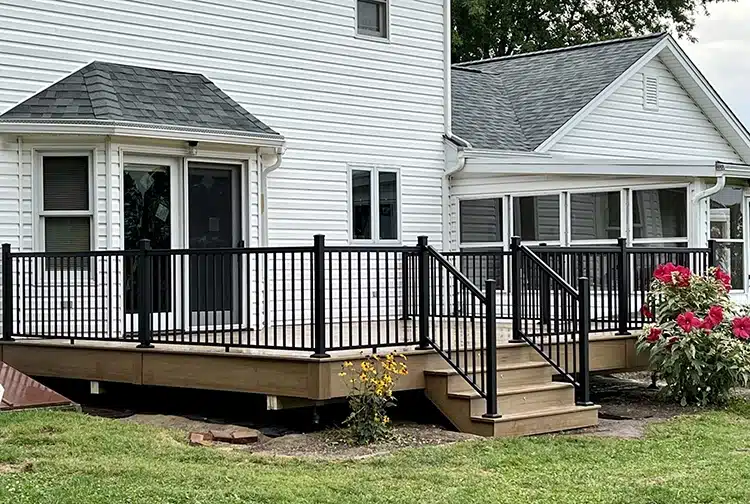 Photo of composite deck with black metal railing