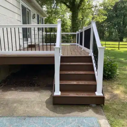 Timbertech decking project with composite stairs and black vinyl railings - Deck builders near me in Doylestown PA