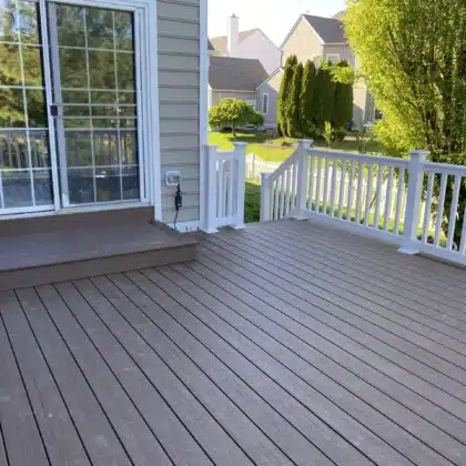 Timbertech decking project with white vinyl railings and lighting - Deck contractor in Chester Springs PA