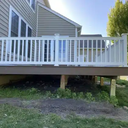 finished Timbertech decking project with white vinyl railings and lighting - Deck building company in Chester Springs PA