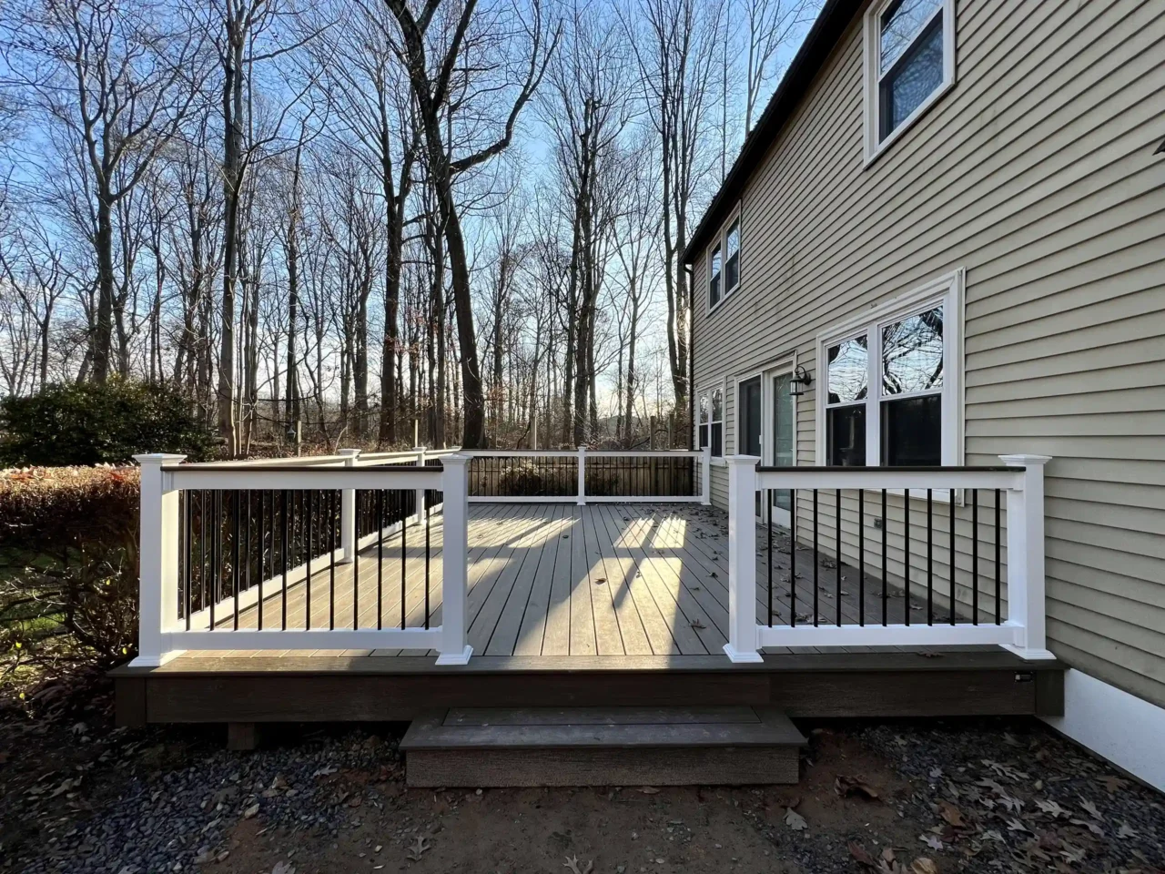 Composite Deck with white vinyl railings - Custom Deck Builders in Doylestown, PA