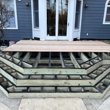 Photo of a deck made of cedar with cedar railing being constructed