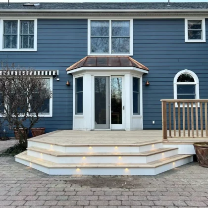 Photo of a cedar deck with steps and cedar railing