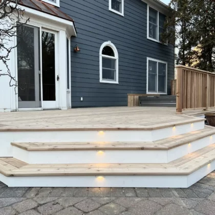 Photo of a cedar deck with steps and cedar railing