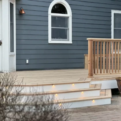 Photo of a cedar deck with steps and cedar railing