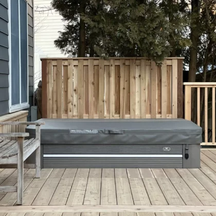 Photo of cedar railings, a cedar deck, a bench, and a hot tub