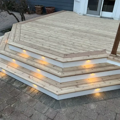 Photo of a cedar deck with steps and cedar railing