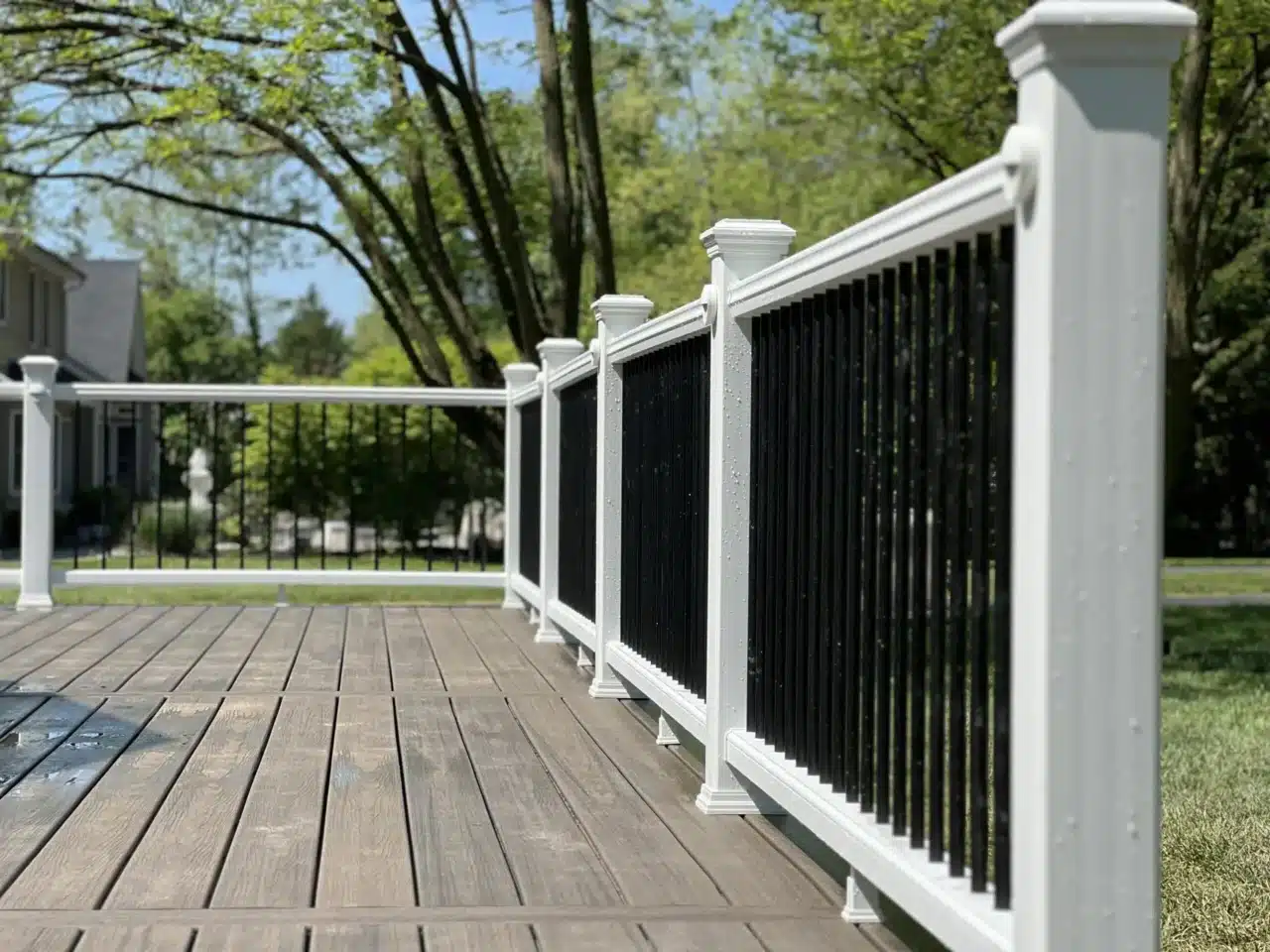 white composite deck railing with black balusters