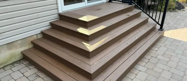 small custom deck design with steps and railing