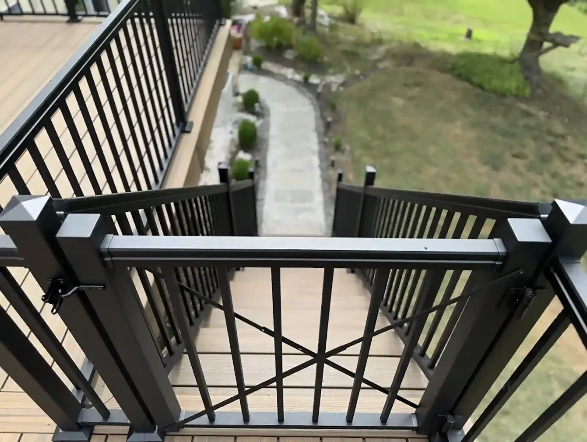 custom deck design feature: Deck railing with a gate