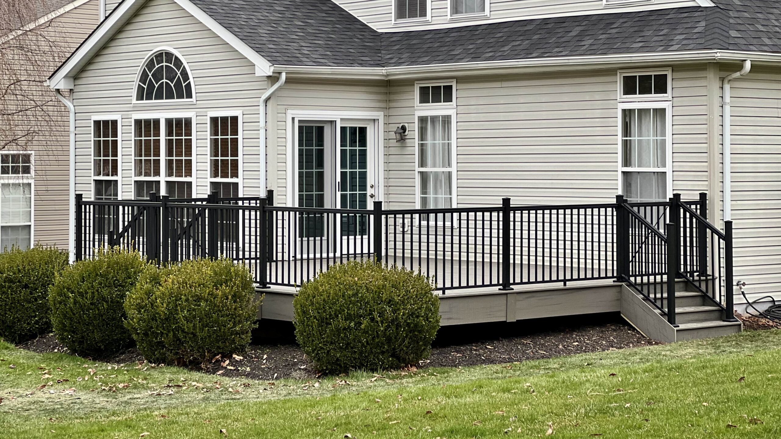 composite deck with black metal railing