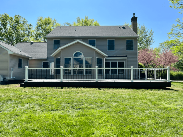 photo of a completed ground-level deck with deck railing - Professional Deck Contractors in PA