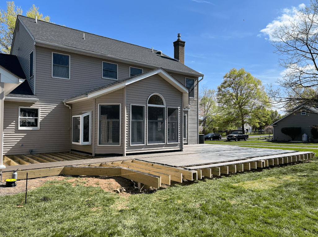 photo of a new deck build with deck board being added