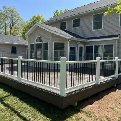 Composite deck with black balausters railing built by Precision Decks in Hatfield, PA