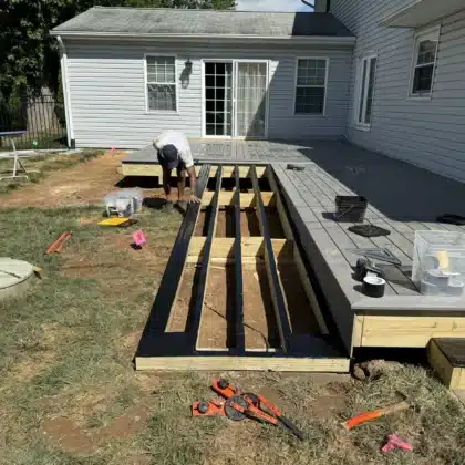 Expert deck builder working in a timbertech composite decking project in Fountainville, PA