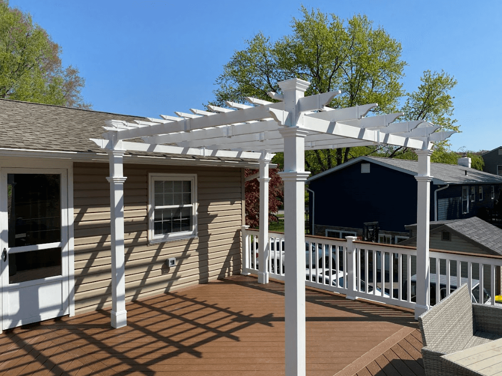 photo of a white pergola on a deck - Decks with pergolas -Elevated deck with pergola