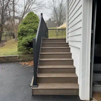 Composite deck stairs with black aluminum Railings in Doylestown, PA